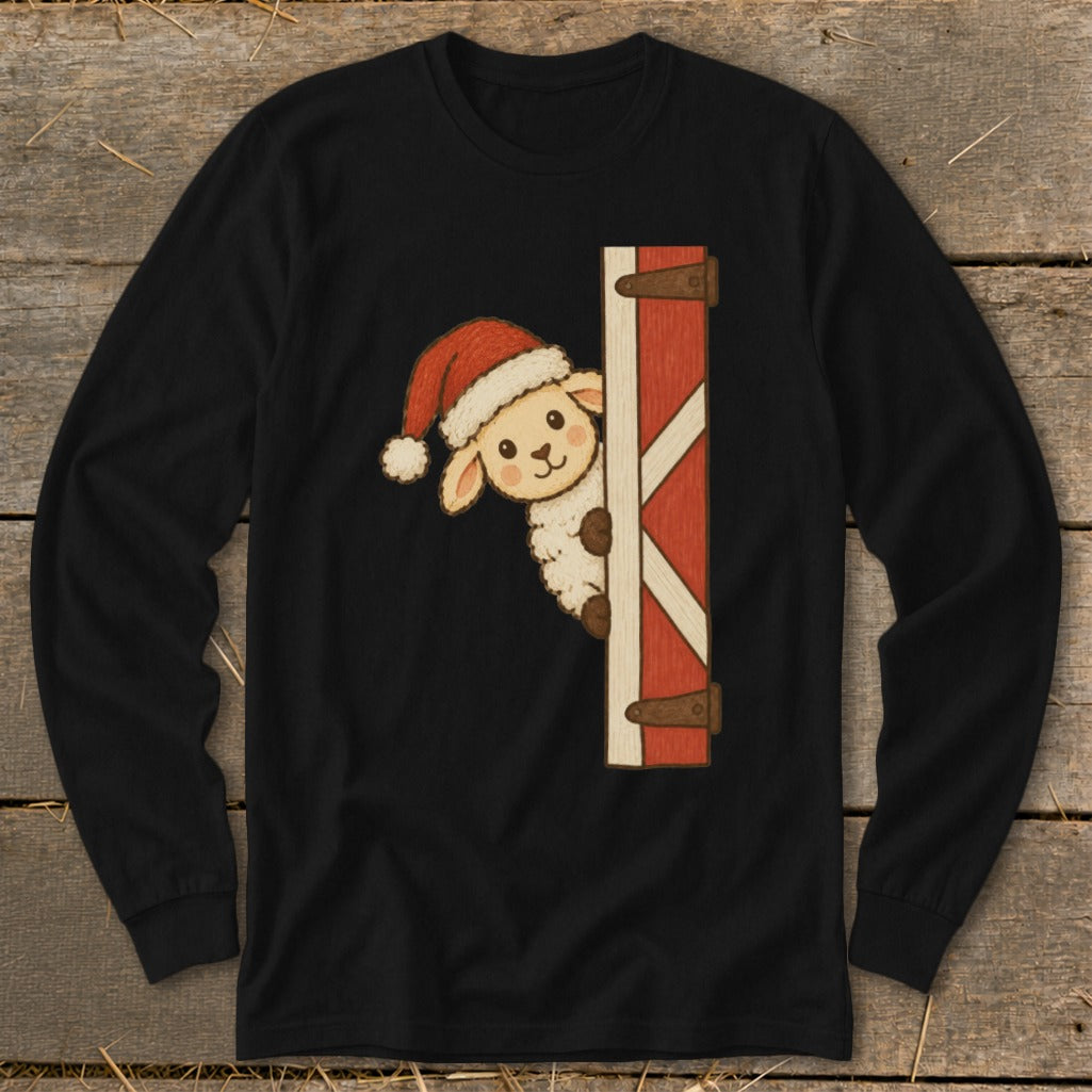 Cute sheep in Santa hat peeking around a red barn door on black shirt.