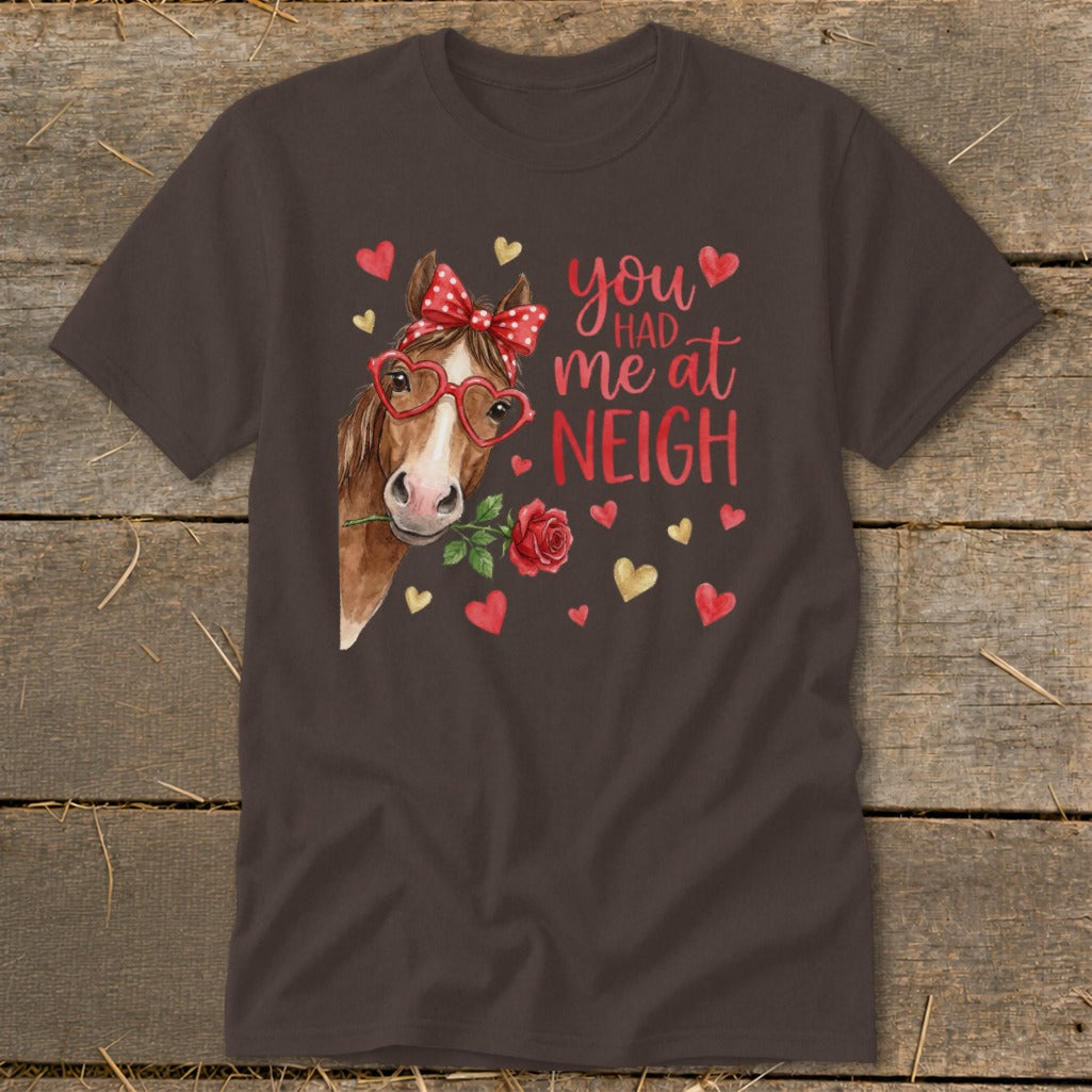 Brown t-shirt with a horse wearing heart glasses and holding a rose, text reads "you had me at NEIGH".