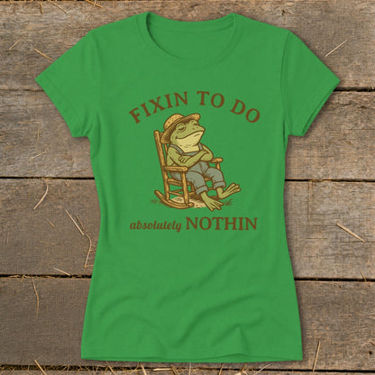 Green t-shirt with frog in rocking chair, "Fixin to do absolutely NOTHIN" text.