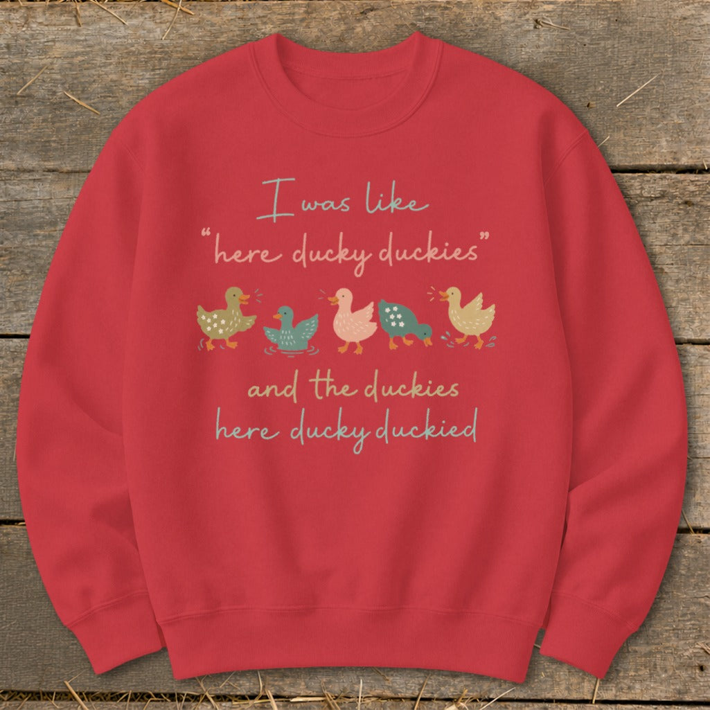 Red sweatshirt with "I was like 'here ducky duckies' and the duckies here ducky duckied" and ducks.