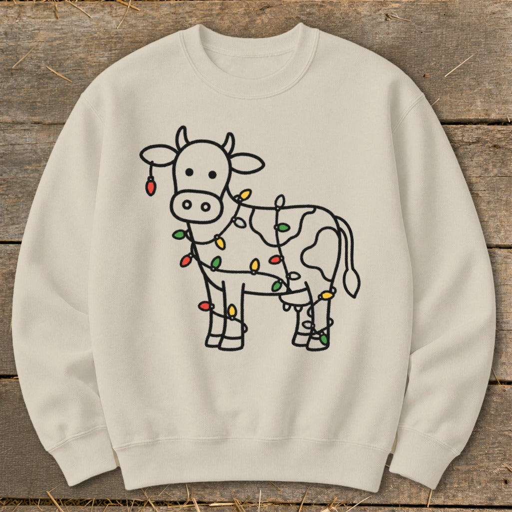 Crewneck sweatshirt with a simple black line drawing of a cow wrapped in colorful Christmas lights.