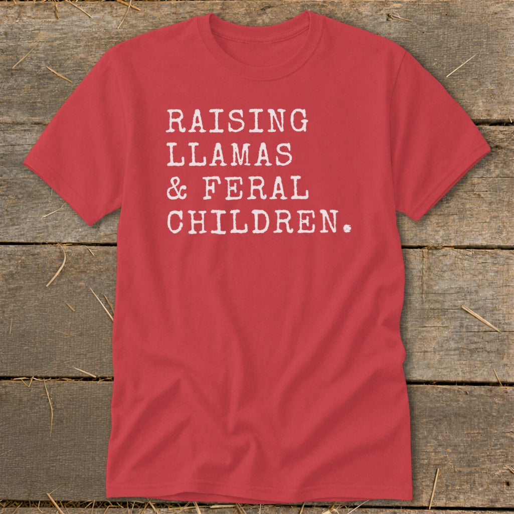 Red t-shirt with white text that reads "RAISING LLAMAS & FERAL CHILDREN."