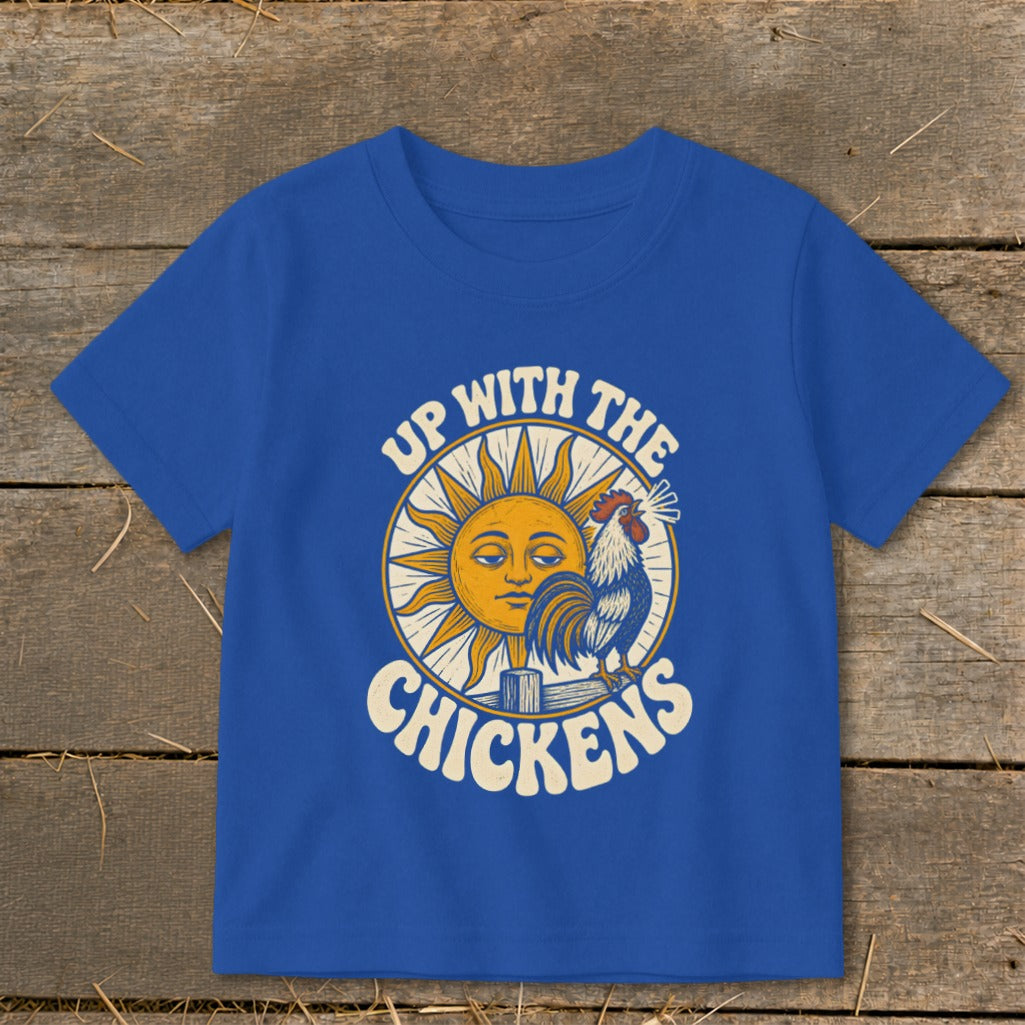 Royal blue short-sleeved t-shirt featuring a retro sun and rooster graphic with text that reads Up With The Chickens.