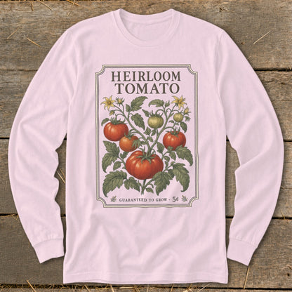 Pink long-sleeve shirt with "Heirloom Tomato" graphic and vintage tomato plant illustration.