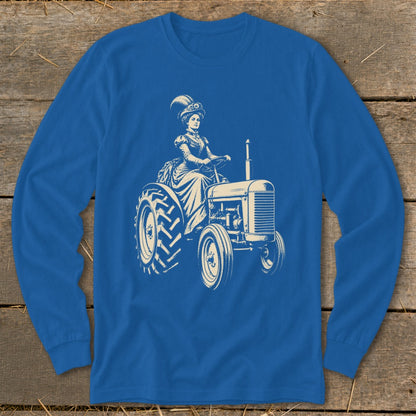 A bright blue long-sleeved shirt features a vintage graphic of a woman in a feathery hat driving a tractor.