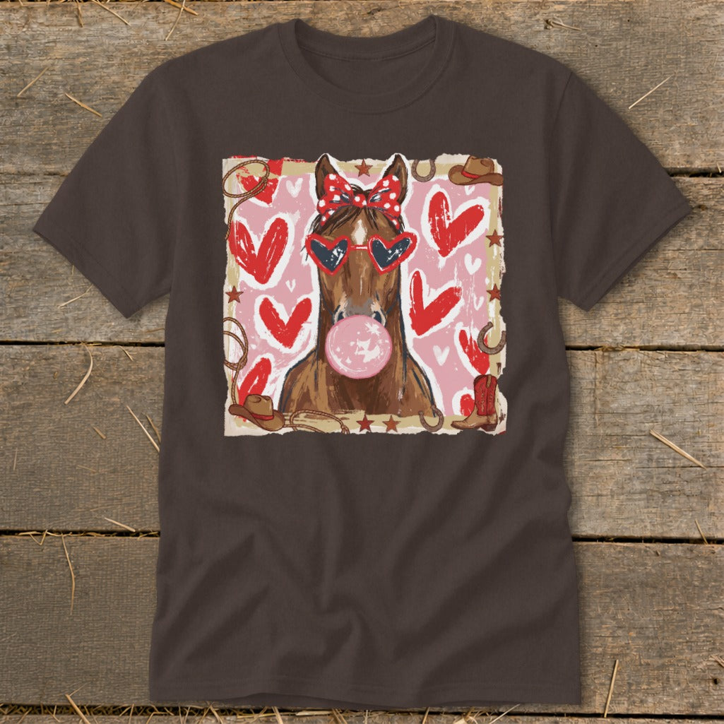 Horse with bandana, heart sunglasses, and bubblegum, surrounded by hearts and Western elements.