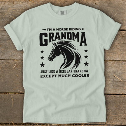Light blue t-shirt with black text and horse graphic reading "I'm a horse riding Grandma except much cooler."