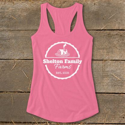 Pink tank top with Shelton Family Farms logo featuring a house and silo.