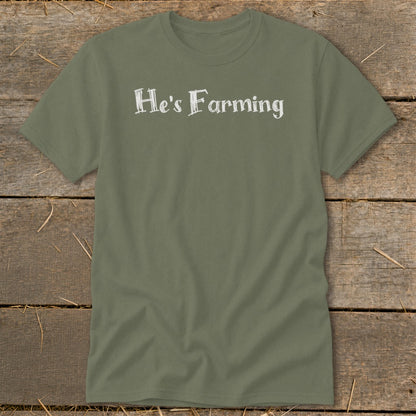 Olive green t-shirt with white text "He's Farming"