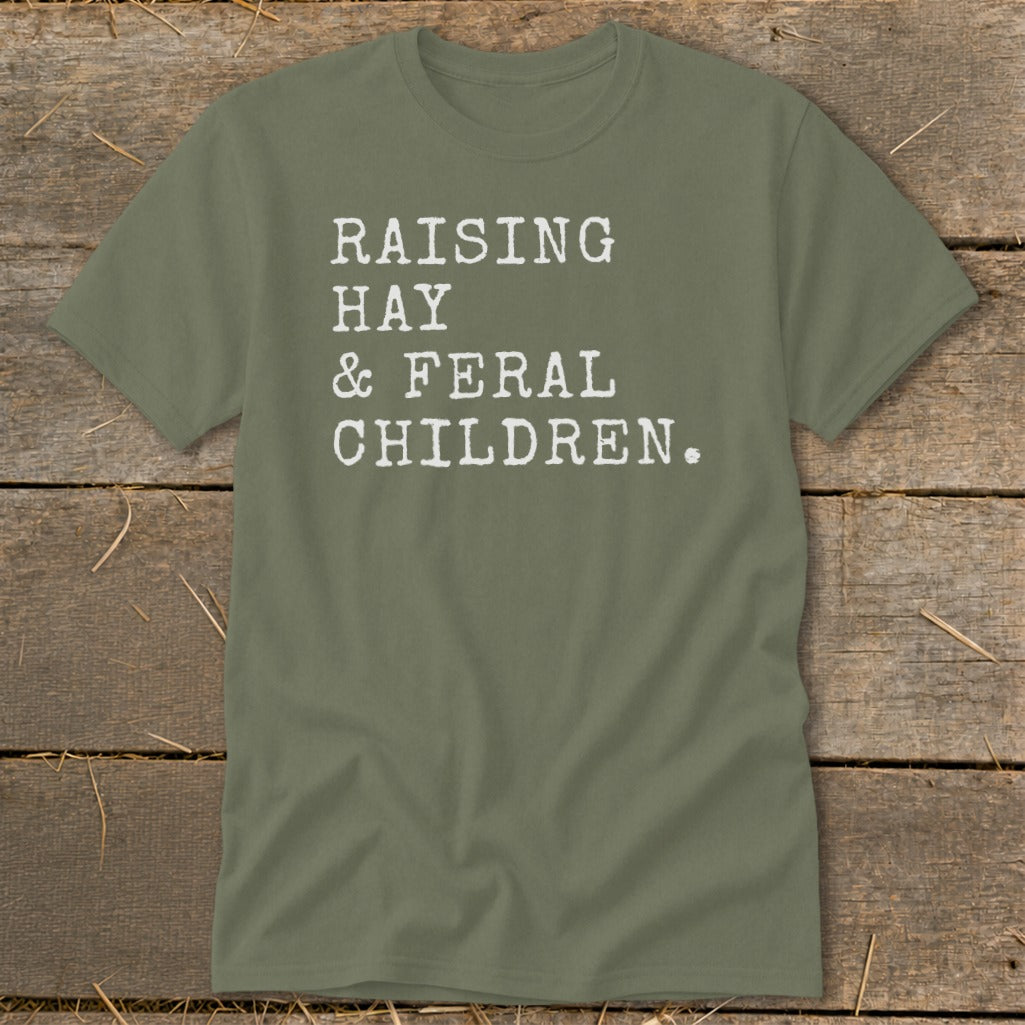Olive t-shirt with white text reading "RAISING HAY & FERAL CHILDREN."