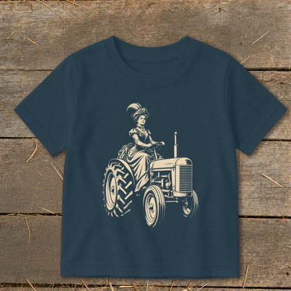 Vintage illustration of woman in hat driving a tractor, printed on navy blue t-shirt.