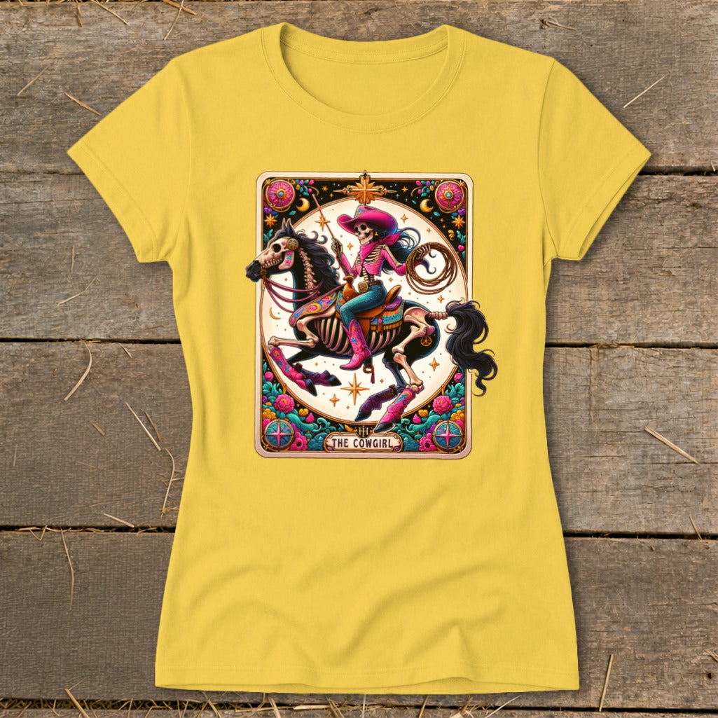 Yellow t-shirt featuring a skeleton cowgirl riding a horse with rope and boots.