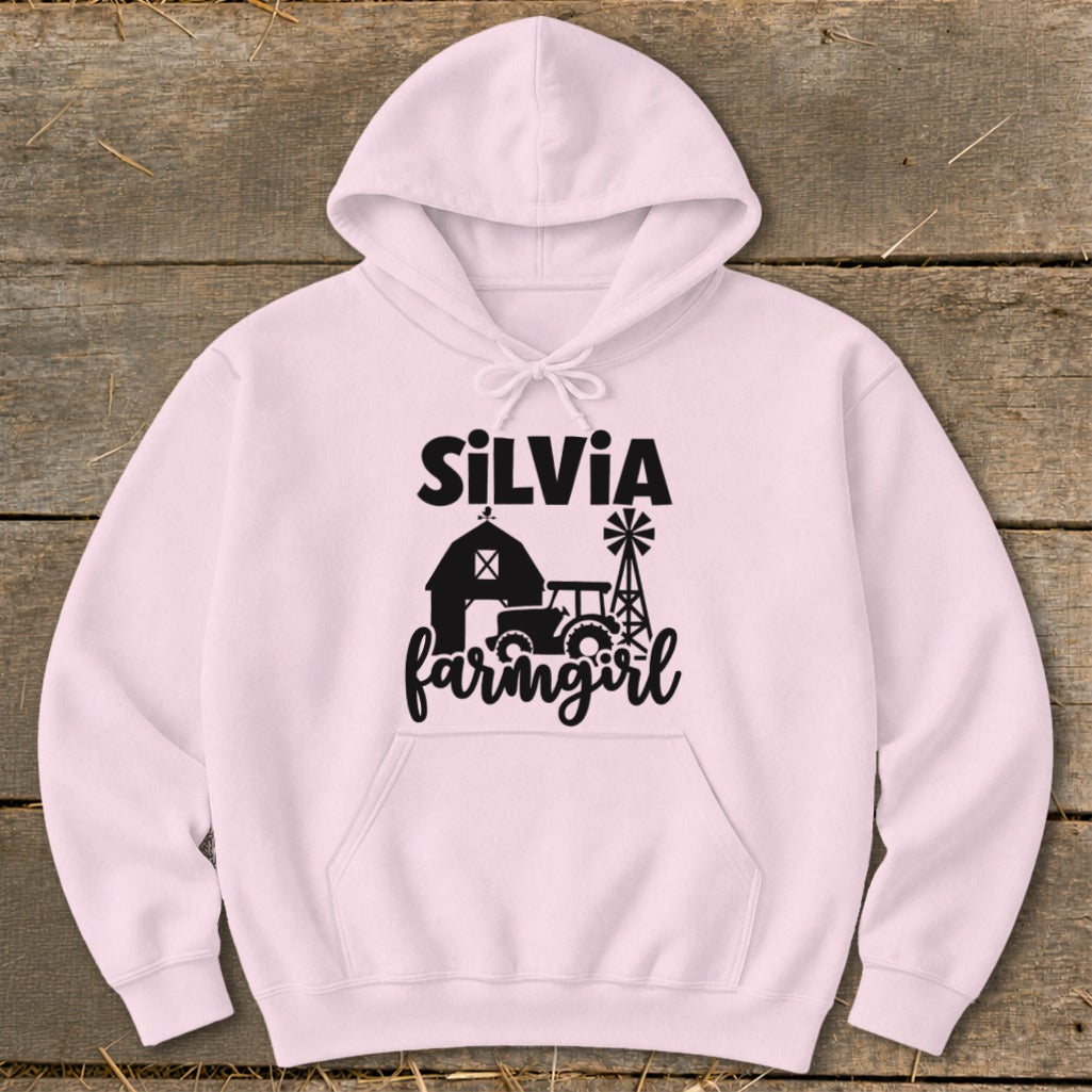 Pink hoodie with "Silvia farmgirl" text and farm graphic.