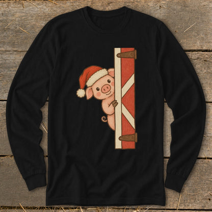 Pig wearing Santa hat peeking from behind a red barn door.