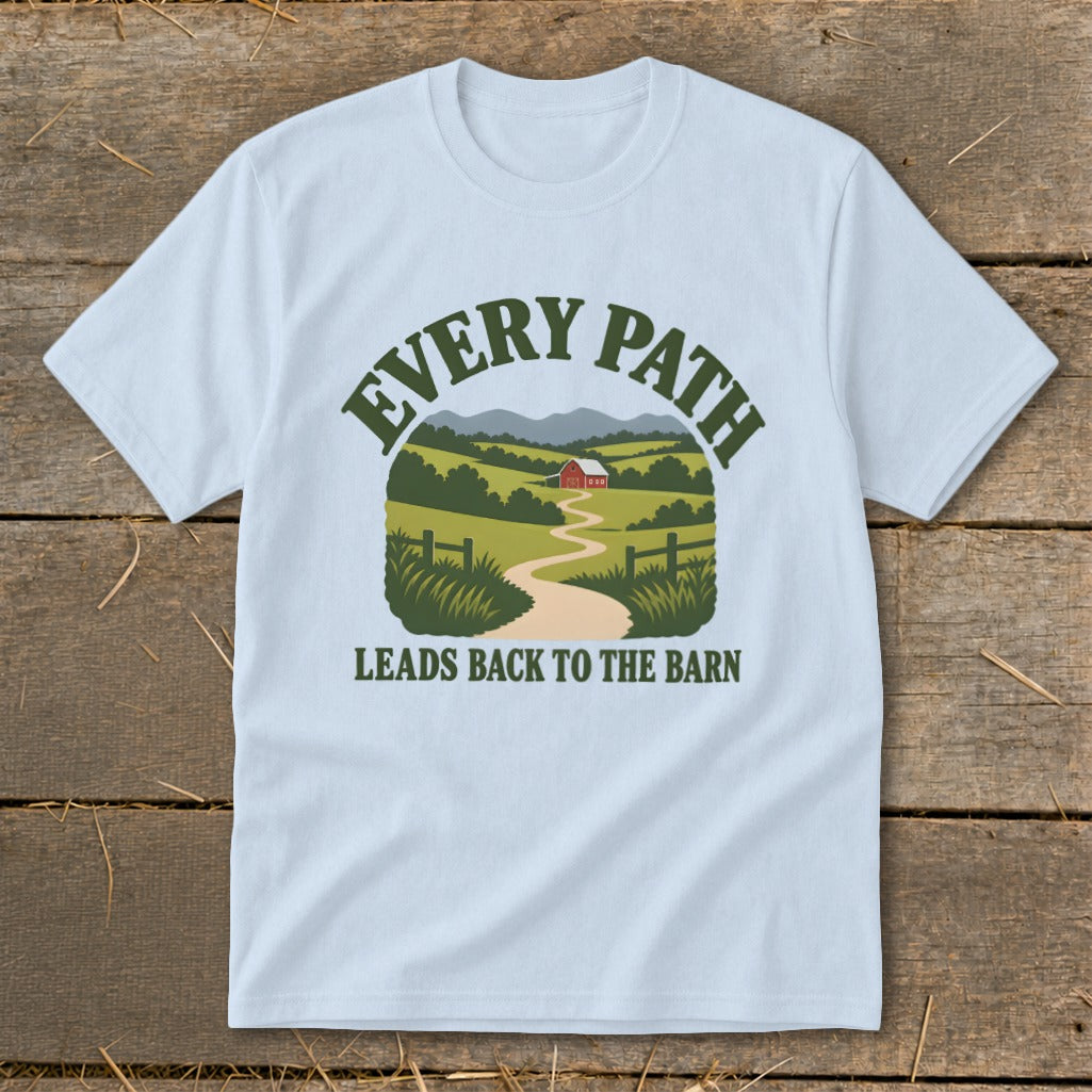 Light blue t-shirt with a graphic of a winding path to a red barn, "EVERY PATH LEADS BACK TO THE BARN".