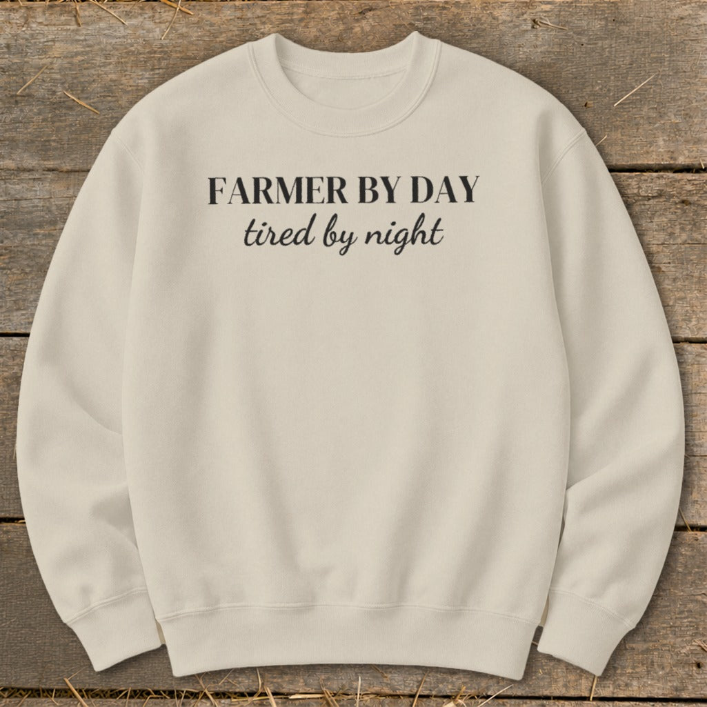 Cream crewneck sweatshirt with text "FARMER BY DAY tired by night"