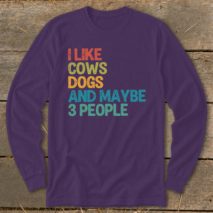 Purple long-sleeve shirt with text "I like cows dogs and maybe 3 people".