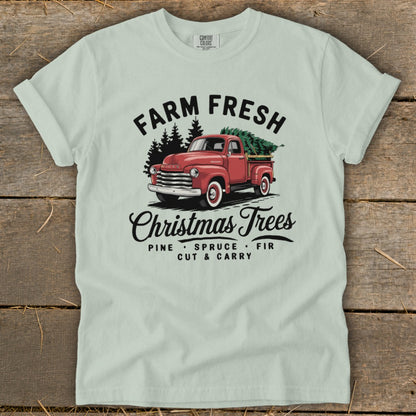 Red vintage truck with Christmas trees, "Farm Fresh Christmas Trees" text.