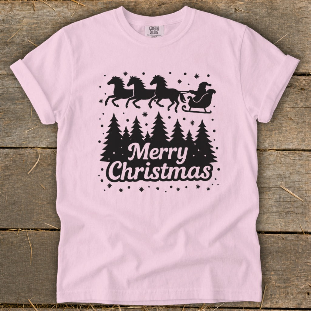 Pink t-shirt with black silhouette of Santa's sleigh pulled by horses and text Merry Christmas.