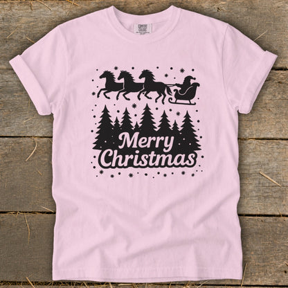 Pink t-shirt with black silhouette of Santa's sleigh pulled by horses and text Merry Christmas.