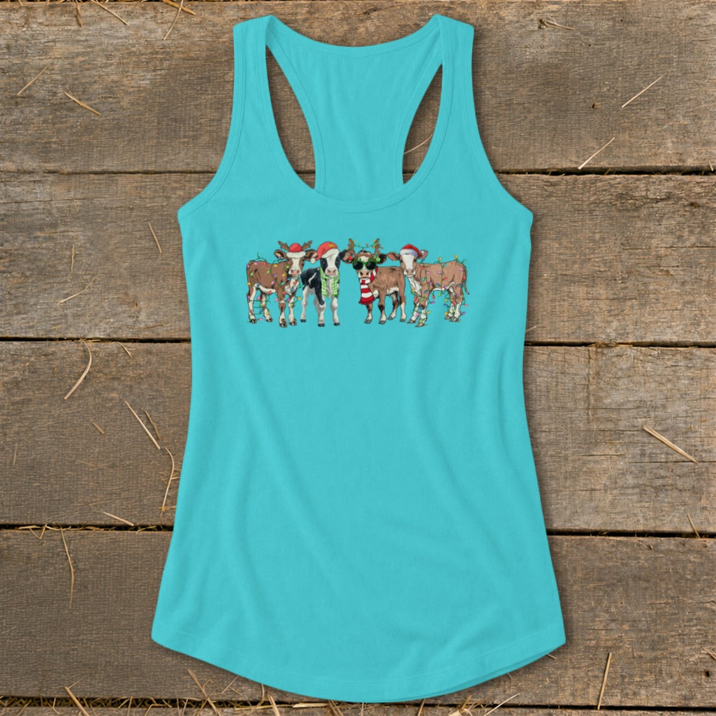 Turquoise tank top with a Christmas-themed graphic of cows wearing Santa hats and lights.