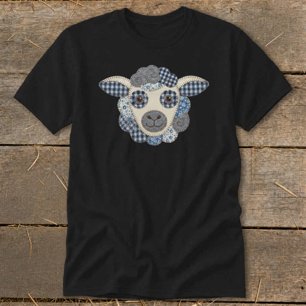 Black t-shirt with a rustic patchwork sheep face graphic on the front.