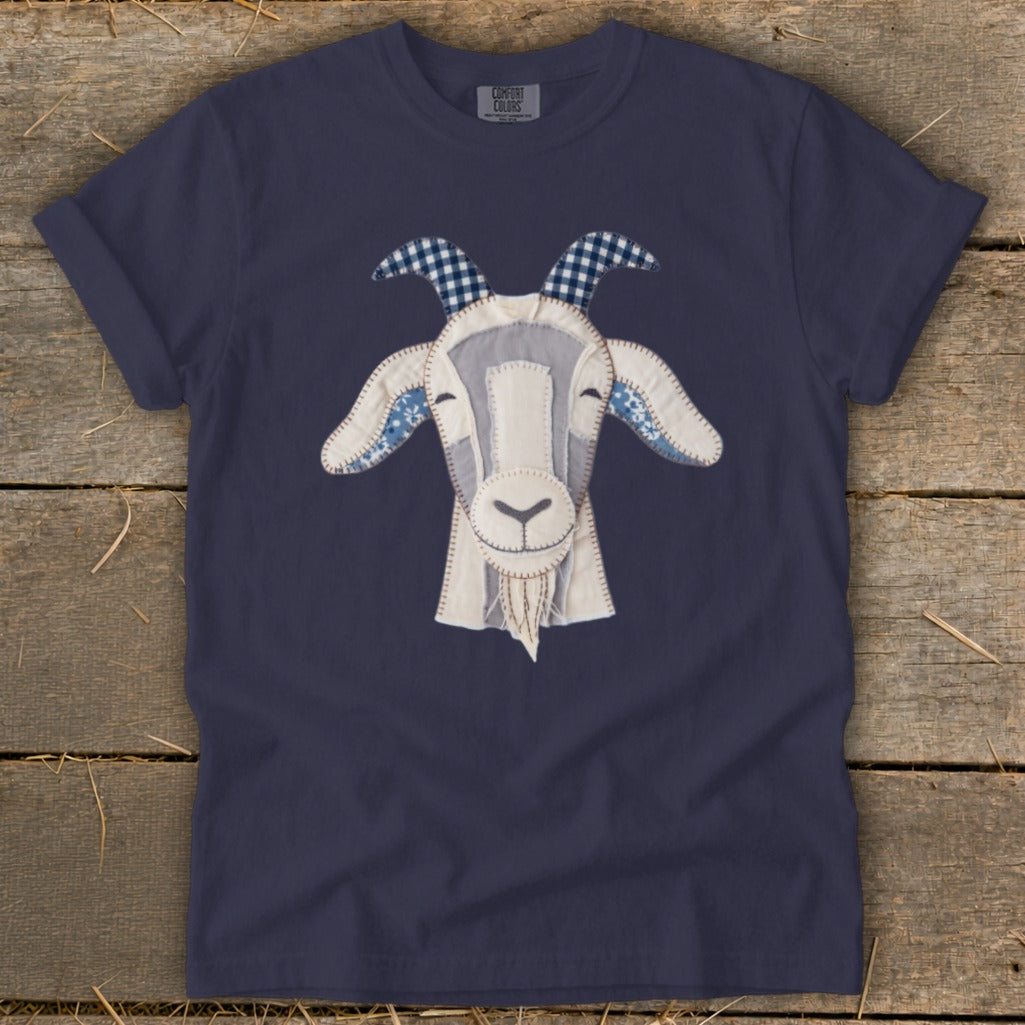 Navy blue t-shirt with a stitched goat head applique and "COMFORT COLORS" tag.