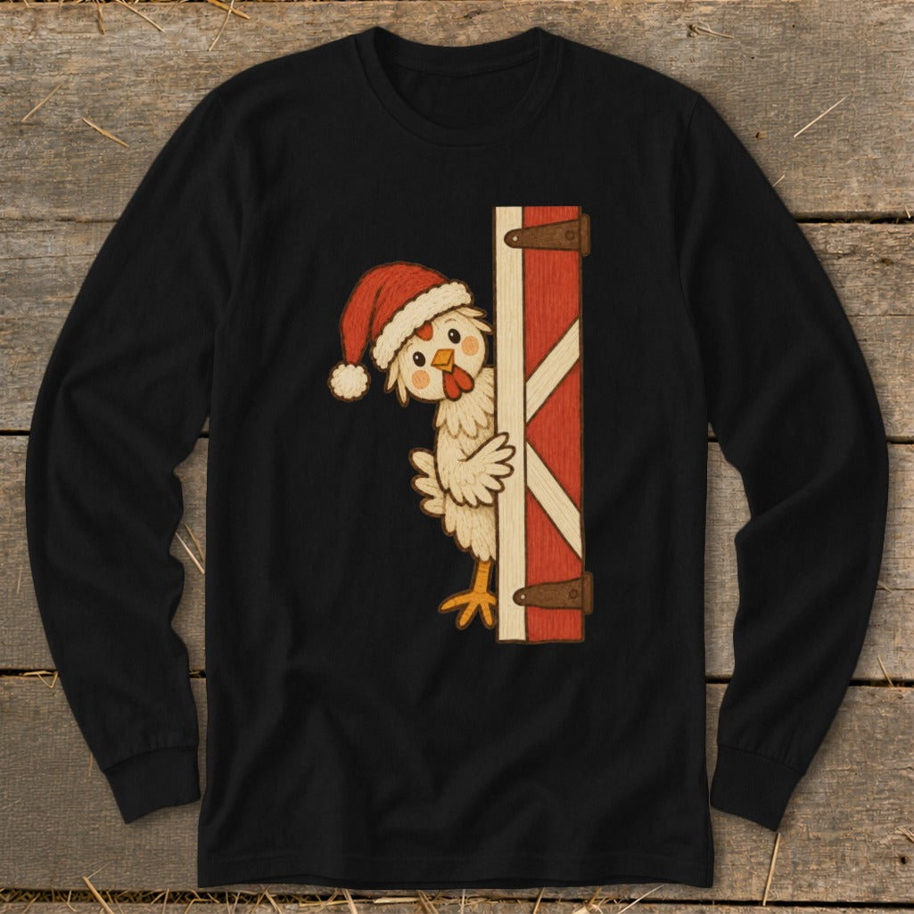 Chicken wearing a Santa hat peeks from behind a red barn door.