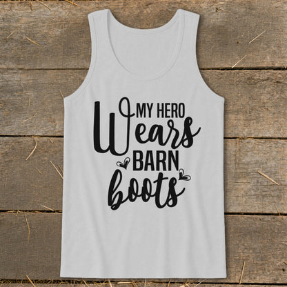 White tank top with black text that reads "My Hero Wears Barn Boots".