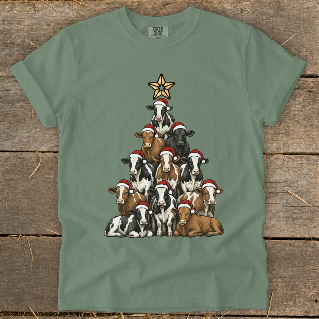 T-shirt features a Christmas tree made of cows wearing Santa hats with a star topper.