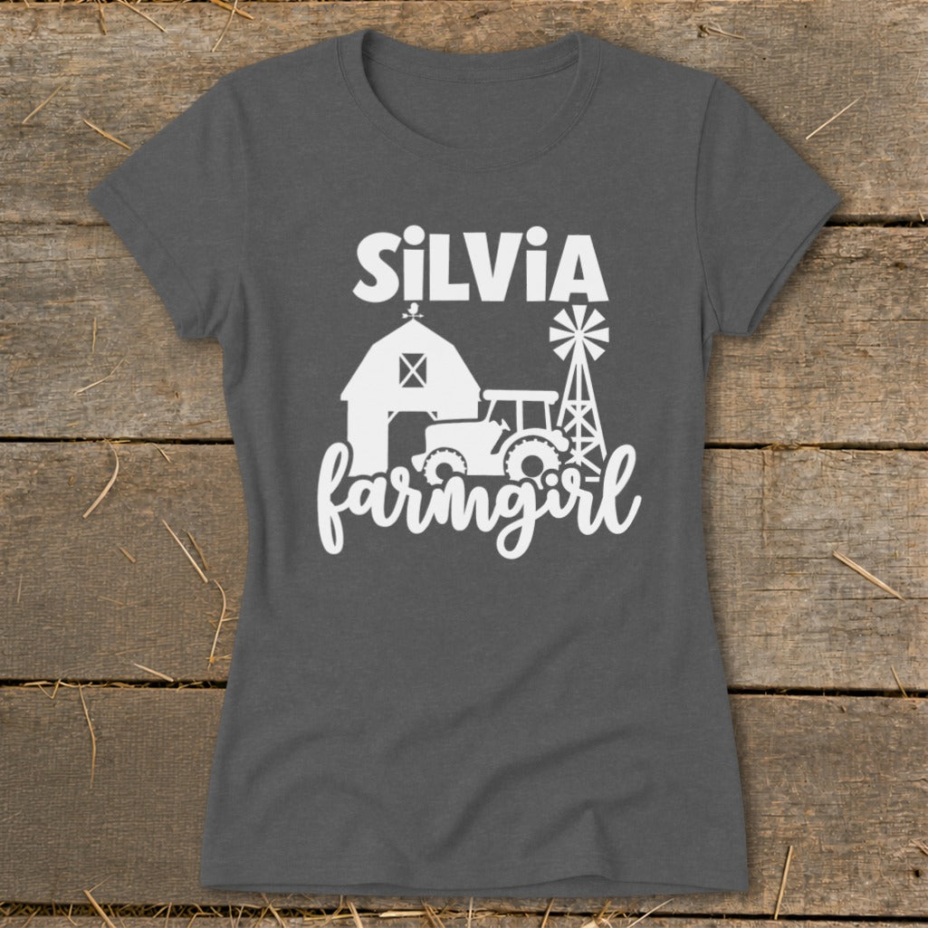 Dark grey t-shirt with white text "SILVIA" and farm scene graphic.