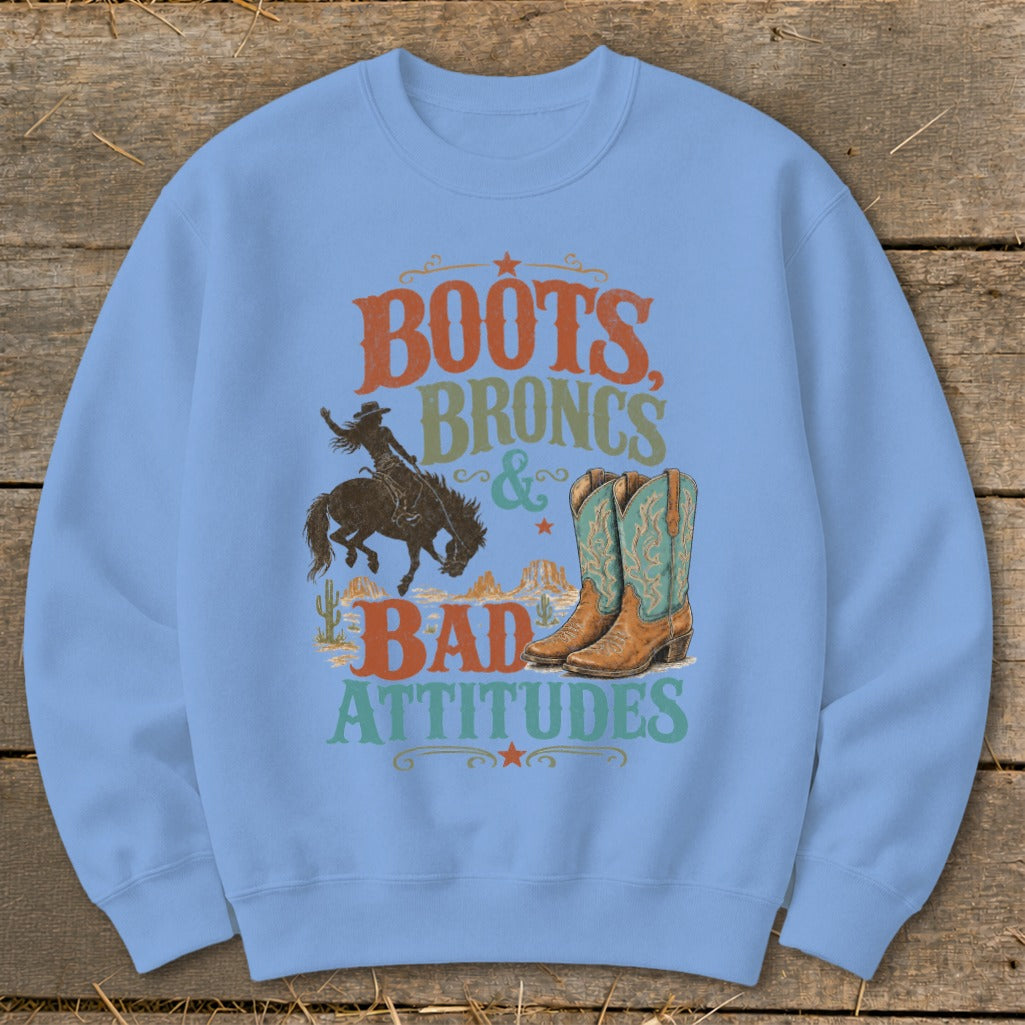 Sweatshirt with "Boots, Broncs & Bad Attitudes" text, cowboy, and boots graphic.