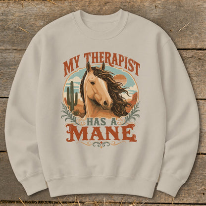 Light brown sweatshirt with "My Therapist Has A Mane" horse graphic and desert scene.