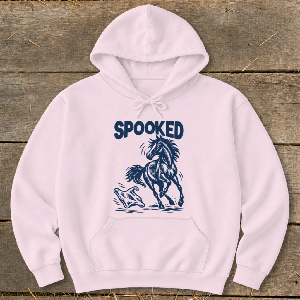 Pink hoodie with "SPOOKED" text and a startled horse and ghost graphic.
