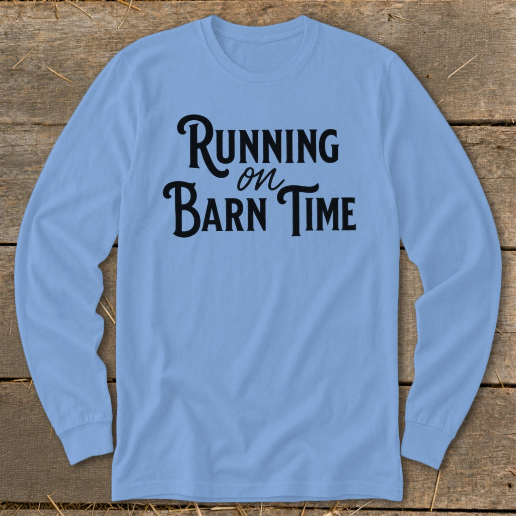 Light blue long-sleeve shirt with black text "Running on Barn Time."