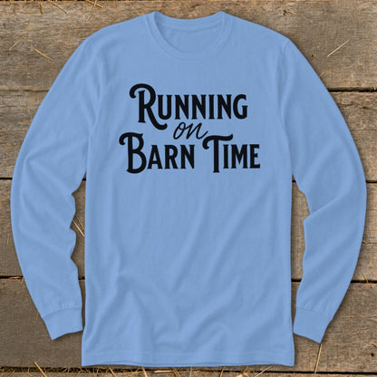 Light blue long-sleeve shirt with black text "Running on Barn Time."