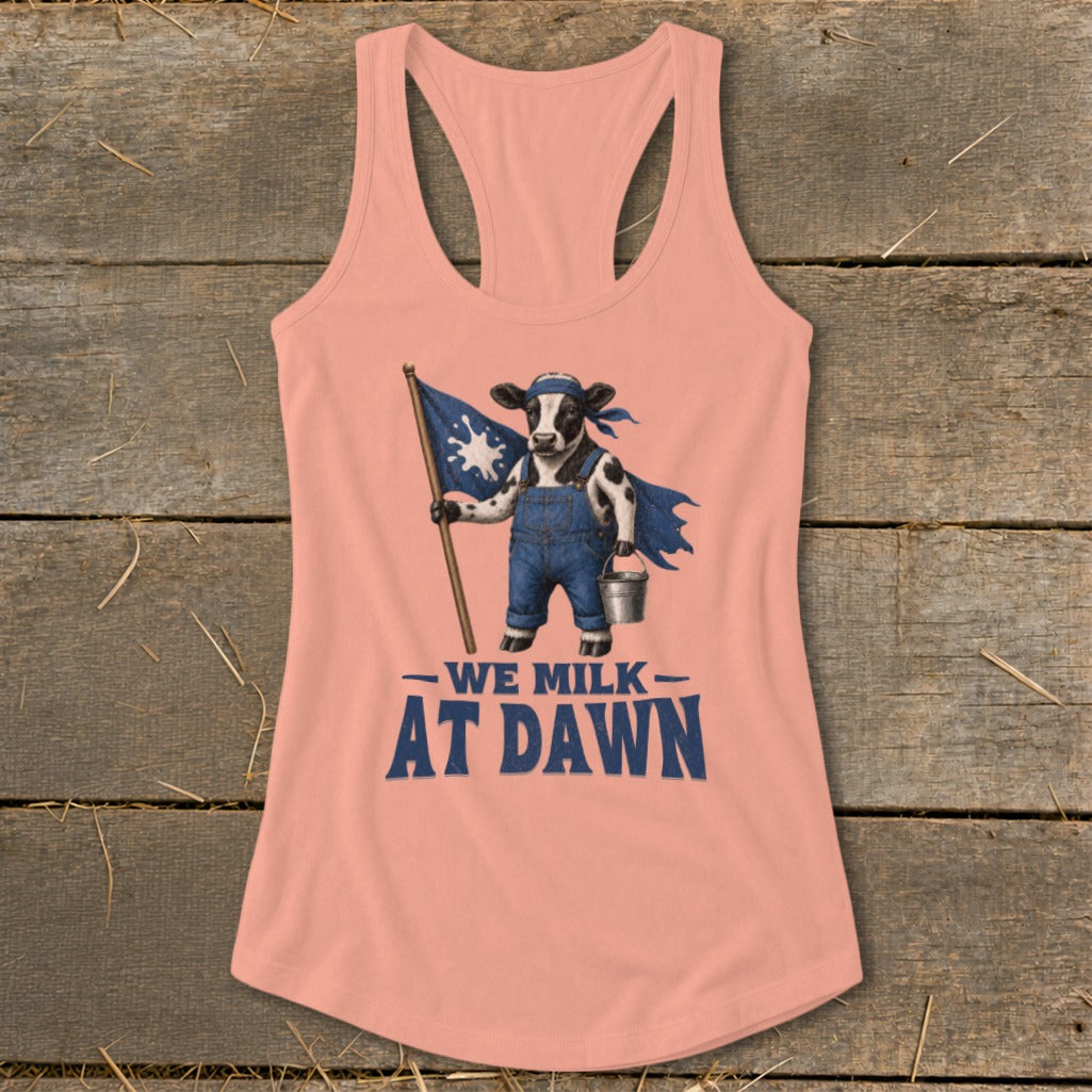Peach tank top with a cow graphic holding a flag and bucket, reading "We Milk At Dawn".