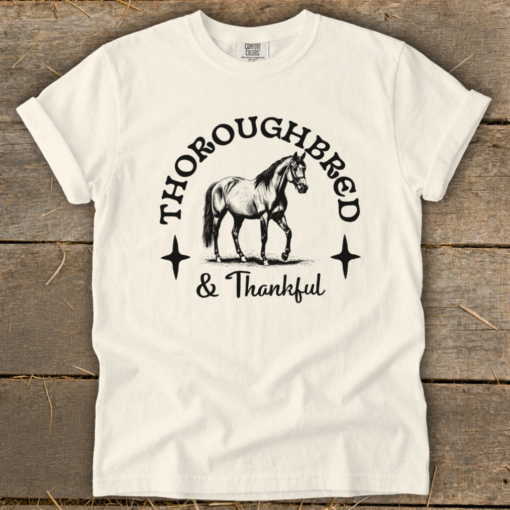 Cream t-shirt with black graphic of a horse and text "THOROUGHBRED & Thankful".
