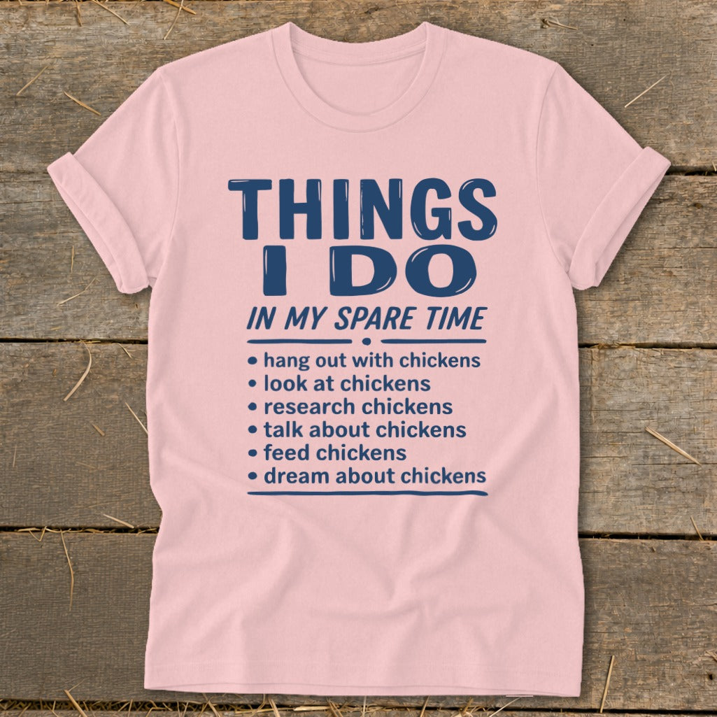 Pink t-shirt with "Things I Do In My Spare Time" and chicken-related activities.