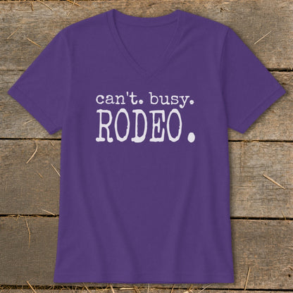 Purple v-neck t-shirt with white text that reads "can't. busy. RODEO."