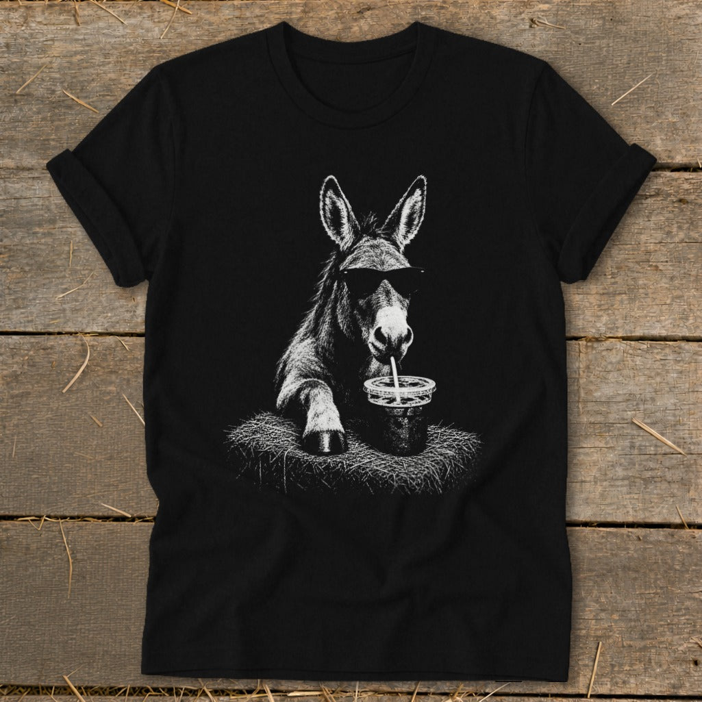 Donkey wearing sunglasses drinks from a cup with a straw, printed on a black t-shirt.