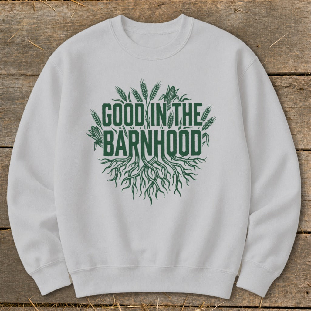 White sweatshirt with green text "GOOD IN THE BARNHOOD" and farm imagery.