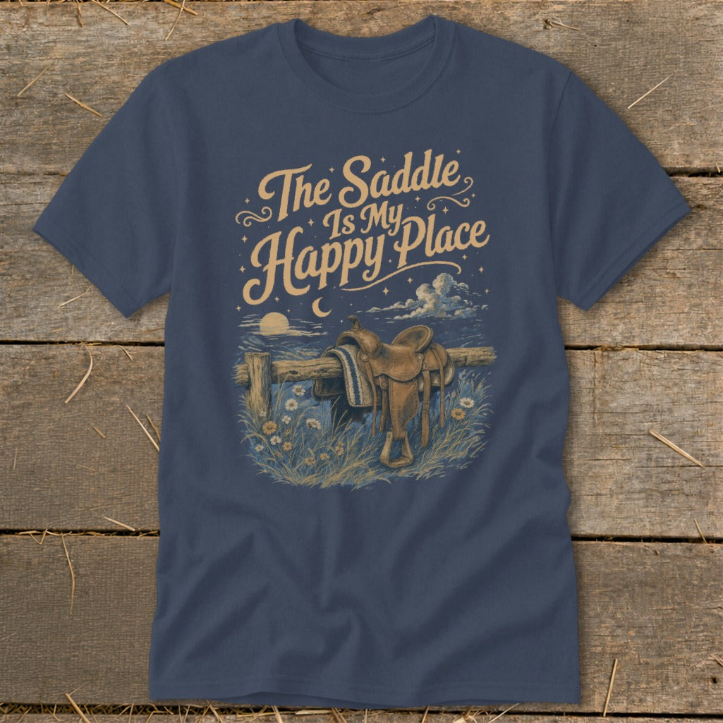 T-shirt graphic with saddle on fence and text "The Saddle Is My Happy Place".