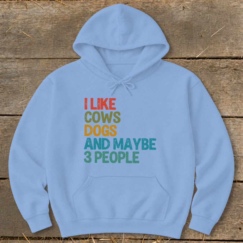 Light blue hoodie with text: I LIKE COWS DOGS AND MAYBE 3 PEOPLE.