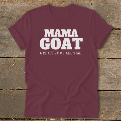Maroon t-shirt with white text "MAMA GOAT GREATEST OF ALL TIME".