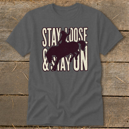 Dark grey t-shirt with distressed "STAY LOOSE & STAY ON" text and bucking horse graphic.
