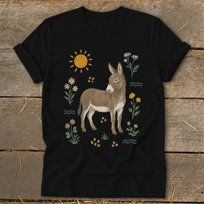 Black t-shirt with a cartoon donkey surrounded by sun, flowers, and waves.