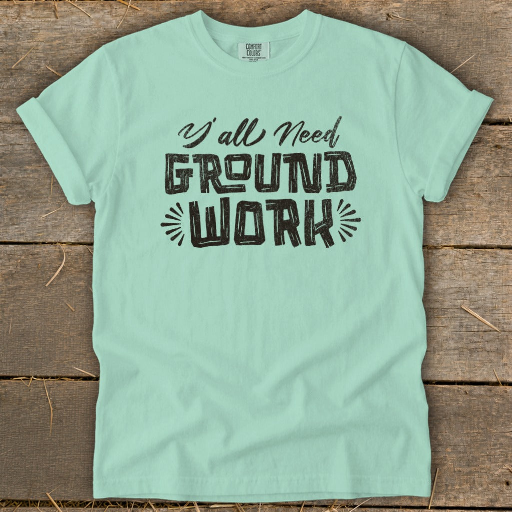 Mint t-shirt with black text "Y'all Need Ground Work".