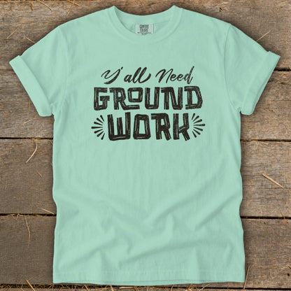 Mint t-shirt with black text "Y'all Need Ground Work".