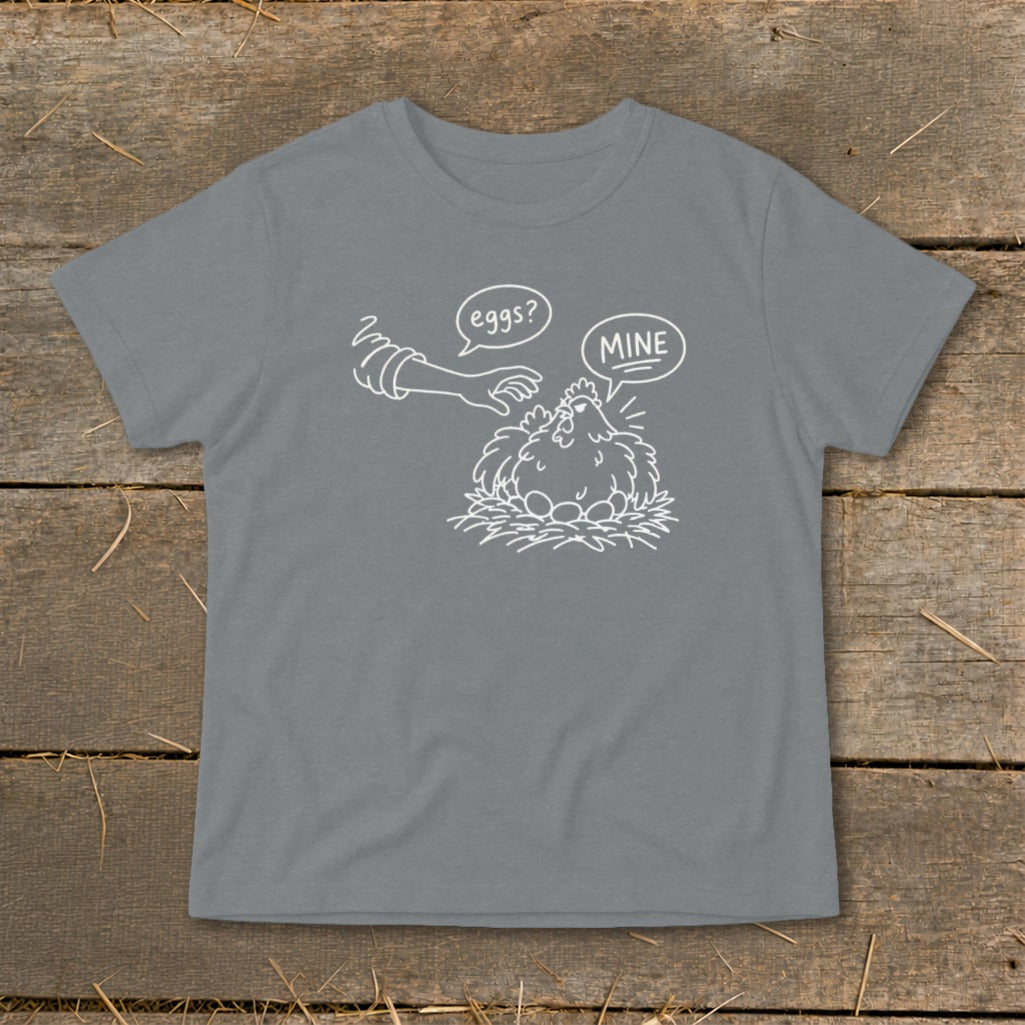Line drawing of a hen protecting her eggs with speech bubbles "eggs?" and "MINE".